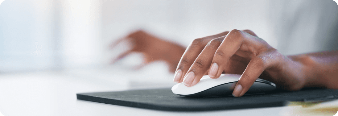 Woman's hand using computer mouse